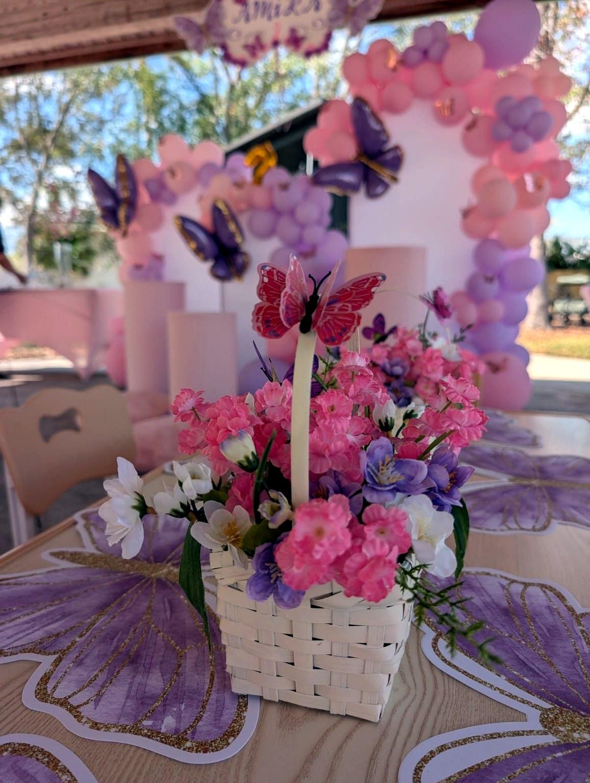 Butterfly-themed birthday decor in lilac and pink