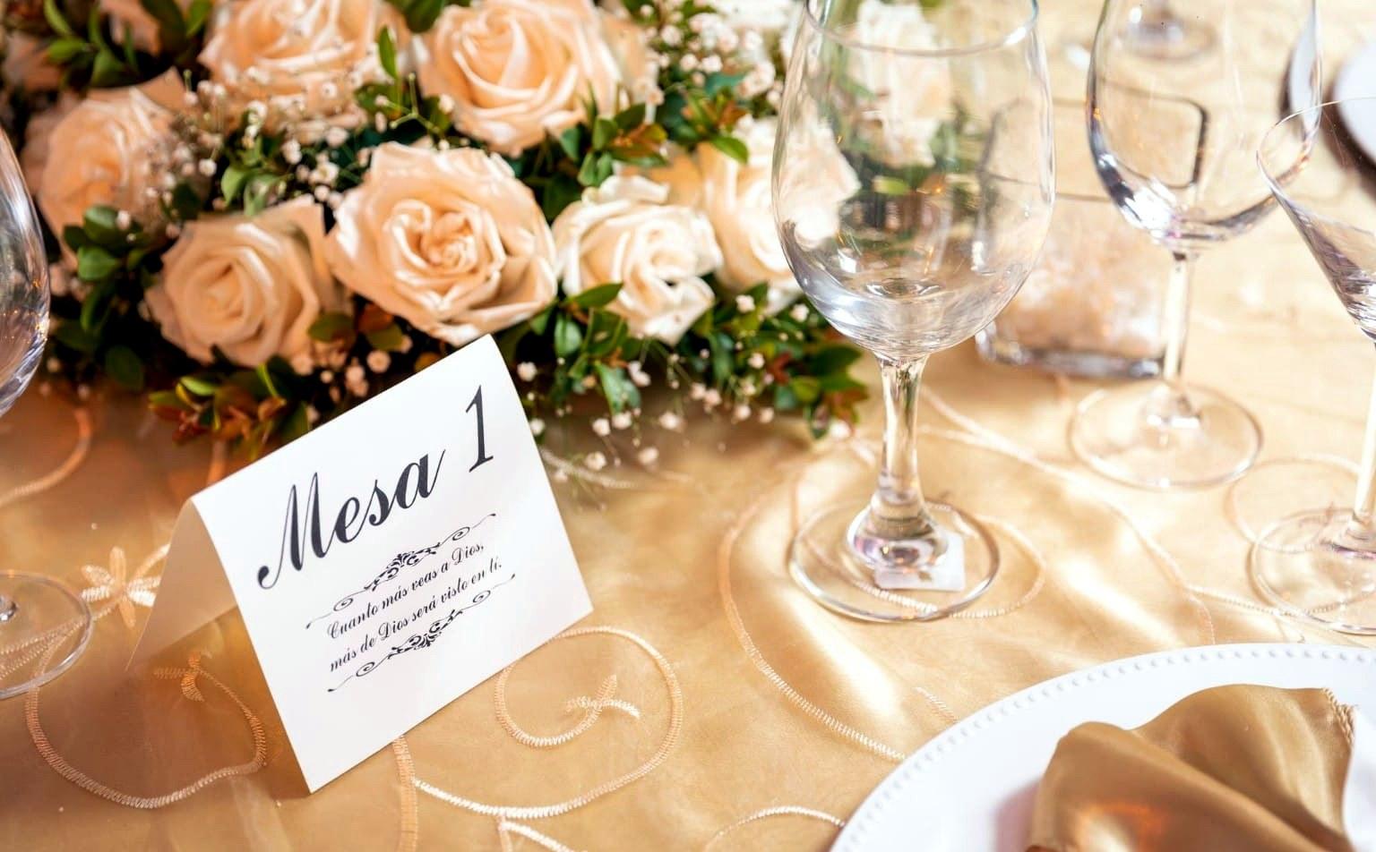 Elegant gold wedding tablescape with champagne roses
